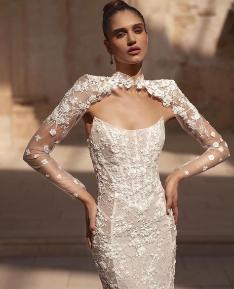 Stepping into timeless elegance with the @julievinobridal Hannah dress. This stunning column gown features intricate floral lace detailing and a touch of sparkle throughout. The scoop neckline and chic cut-out panels add a modern twist, while the detachable lace jacket with statement shoulders offers versatile glamour. Perfect for those unforgettable moments when only the best will do. #JulieVino #bridalelegance #weddingdress #modernbride #weddingdressinspo #hannah #weddinginspiration Scoop Neckline Wedding Dress, Bridal Bolero Jacket, Couture Bridesmaid Dresses, Allure Couture, Wedding House, Bridal Bolero, Bridal Elegance, Column Gown, Fitted Wedding Dress