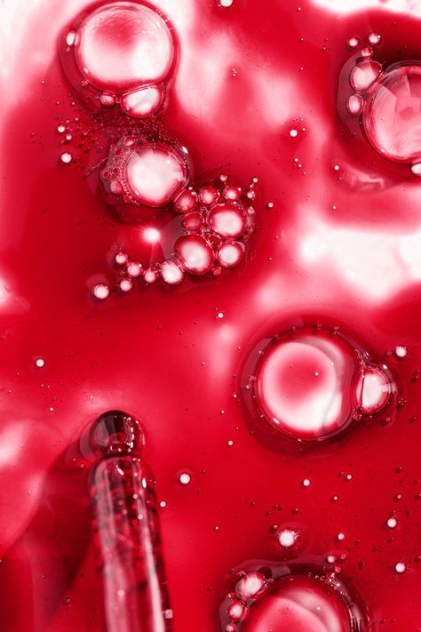 Photograph of exfoliating mask texture with glass dropper and bubbles within the red liquid by Chicago Commercial, Beauty and Fashion Photographer, Olivia Kohler. Beauty Product Texture Photography, Strawberry Texture, Red Skincare, Liquid Photography, Liquid Texture, Red Liquid, Lip Gloss Cosmetics, Photo Products, Exfoliating Mask