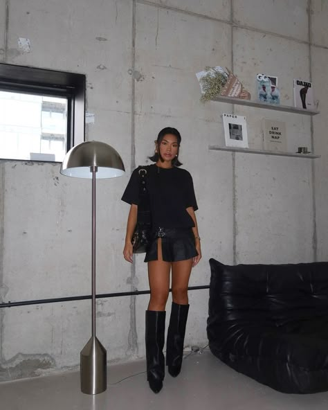 MONOCHROMATIC VIBES 🖤🕷 @x_carms in our Cotton Black Oversized T-Shirt, Black Coated Denim Buckle Detail Ultra Mini Skirt and Black Wide Fit PU Fold Over Knee High Block Heeled Western Boots 👀 Shop via the link in our bio 🔗 Black Skirt Knee High Boots, Denim Skirt Outfit Boots, Denim Skirt Black Boots, Black Skirt Cowboy Boots Outfit, Black Rhinestone Boots Outfit, Folded Boots Outfit, Wide Boots Outfit, Heel Knee High Boots Outfit, Black Boots And Skirt Outfit