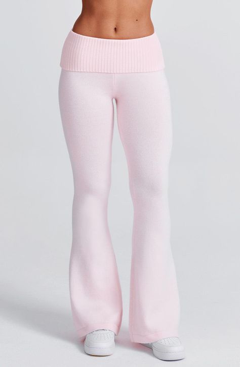 The Portia Knit Pants are a must-have for any wardrobe. These versatile pants feature a flattering fit and flare silhouette, with a wide rib waistband for added style. Complete the look with the matching Portia knit hoodie. Colour: Pink. Regular length. Unlined. Fit and flare silhouette. Wide 2x2 rib waistband. Fold over waistband detail. Internal elastic in waistband. Model is an XS and is wearing an XS. Cool Pants Women, Flared Ribs, Where To Buy Cute Clothes, Pretty Little Thing Set, Pink Flare Leggings, Pink Wishlist, Fold Over Pants, Homecoming Dresses Corset, Cute Bottoms