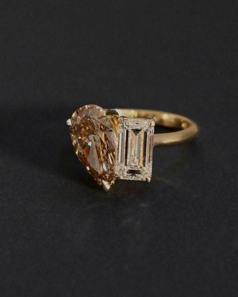 A.G Designer Jeweller on Instagram: "A custom toi et moi featuring a 2.51ct pear cut champagne diamond and 2.01ct emerald cut diamond in 18ct yellow gold. - A.G Designer Jeweller works with our clients to create stunning original pieces, designed and handcrafted on-site in our Brisbane showroom." Pear And Emerald Cut Diamond Ring, Champagne Engagement Ring, Champagne Diamond Ring Engagement, Two Stone Diamond Ring, Champagne Diamond Engagement Ring, Brown Diamond Engagement Ring, Champagne Diamonds Engagement, Champagne Diamond Ring, Ring Cuts