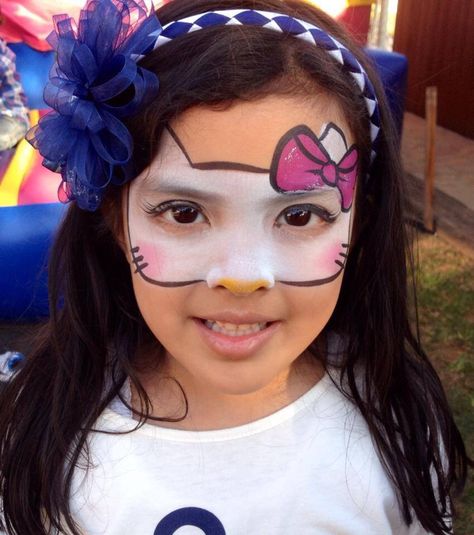 Hello Kitty face painting Face Painting Hello Kitty, Hello Kitty Face Painting, Paint Hello Kitty, Hello Kitty Face Paint, Hello Kitty Funny, Rainbow Face Paint, Hello Kitty Costume, Kitty Face Paint, Cats Face