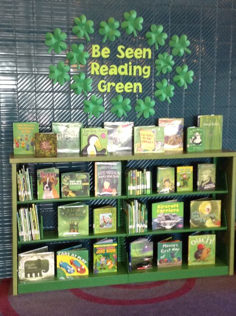 Be Seen Reading Green. March book display with 3-D clovers and any book with a green cover. These color-themed displays are some of our most popular! Pride Month Book Display, March Reading Bulletin Board Ideas, March Library Bulletin Boards, March Book Displays, Library Puns, Library Lovers Month Display, School Library Book Displays, Bookstore Ideas, March Book