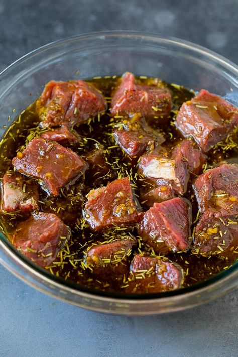 Steak cubes in a bowl of marinade. Shishkabobs Marinade Beef Kabobs, Steak Shish Kabob Marinade, Beef Shish Kabobs On The Grill, Stew Meat Marinade Beef, Beef Shish Kebabs Recipes, Kabob Marinade Recipes Beef, Beef Marinade For Kabobs, Steak Kabobs On The Grill Marinade, Beef Kabobs On The Grill Marinade