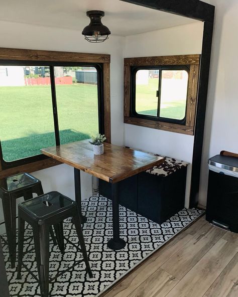 This renovated Fleetwood Prowler serves as a full-time home on wheels for a young married couple. Renovation and Photos by @home.sweet.camper #rvrenovation #camper #rvinspiration #rvliving #rvinteriorideas #glamping #fleetwood #fifthwheel #5thwheel #modernRV #styleonwheels #homeonwheels #rvtour #rvbeforeafter #rvrenoideas #rvdecorideas #rvinterior #tinyliving #rvmakeover #camperrenovation #wanderfulrvinteriors Black And Brown Camper Interior, Camper Dining Booth Remodel, Farmhouse Camper Remodel, Remodeling Campers Interior, Camper Upgrades, Modern Camping, Young Married Couple, Camper Mods, Camper Remodel Ideas