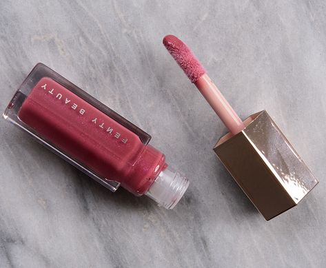 Fenty Beauty RiRi Gloss Bomb Lip Luminizer ($21.00 for 0.3 oz.) is a muted, medium-dark pink with subtle, warm undertones and fine, barely-there lavender and pink pearl throughout. Semi-sheer to semi-opaque, buildable coverage Lightweight, smooth, plush Applied evenly and softened the look of lip lines Long-wearing (4 hours), hydrating Fenty Lip Gloss Riri, Fenty Beauty Lip Gloss Riri, Fenty Beauty Lip Gloss, Perfect Pink Lipstick, Fenty Beauty Gloss Bomb, Pink Gloss, Lip Gloss Shades, Makeup Wishlist, Lip Balm Set