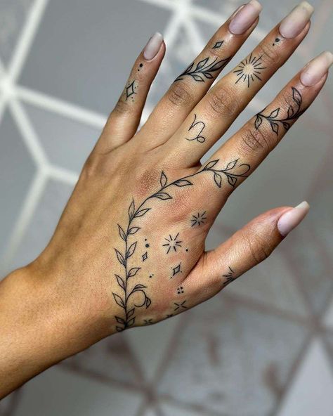 More Ideas you look in our site Women Dainty Hand Tattoos, Hand Tattoos About God, Tattoo Ideas Female Hand Design, Hand Tattoo Wrap Around, Hand Tattoo Placement Ideas, Women’s Tattoos Finger, 2x2 Tattoo Ideas Meaningful, Hand Tattoos For Women Floral, Leaf Hand Tattoos For Women