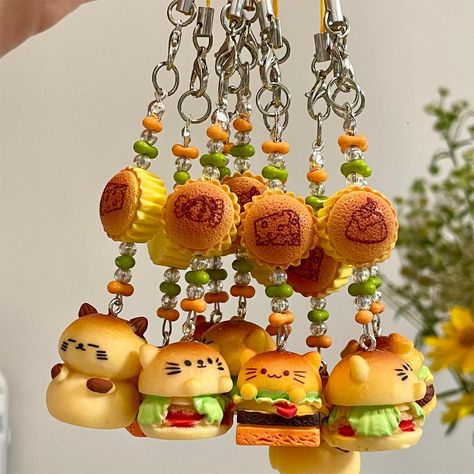 Cute Animal Hamburger Keychain Phone Strap Add a touch of cuteness and functionality to your keys or phone with our Cute Animal Hamburger Keychain Phone Strap. This charming accessory features a cute animal design with a hamburger charm. Perfect for animal lovers and those who appreciate adorable accessories on the go. Mango Keychain, Cute Clay Keychains, Mini Clay Art Easy, Cute Clay Things, Cute Keychain Ideas, Clay Keychain Ideas, Kawaii Clay Charms, Cute Clay Charms, Aesthetic Phone Charms