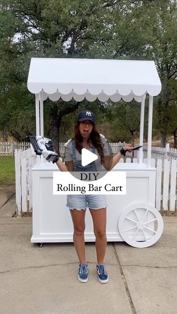 Trish 💕 Beautiful Lifestyle Blogger on Instagram: "I am so excited to share my diy bar cart!!! I used @harttoolsusa to make the cutest rolling bar cart! I love how it turned out. Using @harttoolsusa made this project go so smoothly! I only used their tools for this entire project and they were perfect for the job! My husband helped me create the design for the roof and I created the design for the bottom half! I love how it’s mobile and easy to set up and take down. I have a full tutorial coming soon!!! Let me know if you want the full tutorial??? #DoItWithHart #HARTPartner 
.
.
#girlswithtools #diy #diyprojects #project #diyproject #diypartydecor #diycraft #diycrafts #diyhomedecor #girlswhobuild #youcandoit #woodworker #powertools #walmart #partyplanner #eventplanner #partydecorations #p Diy Bar Cart For Wedding, Diy Catering Cart Plans, Candy Carts Ideas Display, Diy Tea Cart, Diy Party Cart With Wheels, Diy Food Cart Ideas, Waffle Stall Ideas, Diy Desert Cart, Plywood Diy Ideas