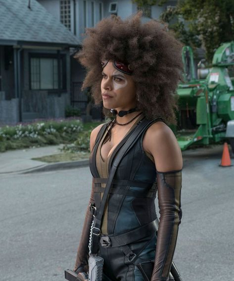 Still stuck on a Halloween costume? Your natural hair is the perfect place to start. #halloween #halloweenbeauty #halloweenhair #fallhair #naturalhair #curlyhair #halloweencostume #fallseason #holidayhair Domino Deadpool, Quick Halloween Costumes Last Minute Men, Costumes For Black Women, Natural Hair Black Women, Deadpool 2 Movie, Domino Marvel, Quick Halloween Costumes, Halloween Costumes For Work, Zazie Beetz