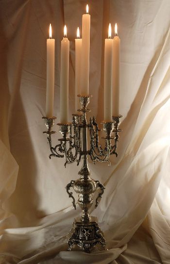 Phantom of the Opera feel to it... I like it! And I have a slight obsession with candelabras anyway Masquerade Prom, Silver Candelabra, Masquerade Wedding, Masquerade Party, Masquerade Ball, Phantom Of The Opera, Sweet 16, String Lights, Wedding Centerpieces