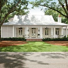 Louisiana Acadian style home in Baton Rouge. Design by Mia James. Acadian Style Homes Louisiana, Southern Paint Colors, River House Exterior, Acadian Style Homes, Acadian Homes, Low Country Homes, Creole Cottage, Louisiana Homes, Porch House Plans