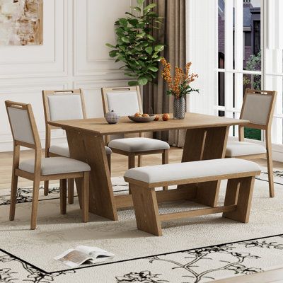 This Retro Dining Set, showcasing a unique fusion of vintage and rustic styles, is crafted from high-quality wood for durability. Its striking design features, including a trapezoidal table base and carved lines on chairs, offer a cozy ambiance in any dining space. Mercer41 Table Top Colour: Brown, Chair Colour: Natural Wood Wash, Table Base Colour: Natural Wood Wash | Mercer41 6-Piece Retro Dining Set Brown, Solid Wood | C111849575 | Wayfair Canada Flexible Seating, Dining Furniture Sets, Dining Room Bar, Rectangular Dining Table, Straight Lines, Table Seating, Rectangular Table, Formal Dining Room, Dining Room Sets