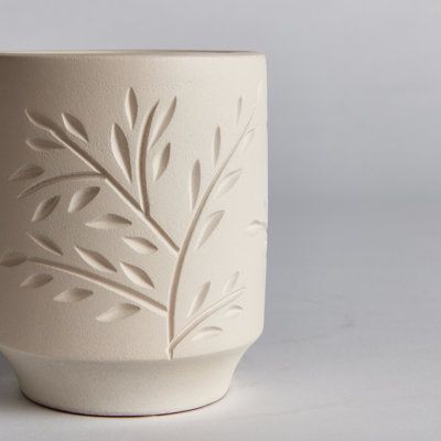 Using ancient techniques of their ancestors, the artisans of Chulucanas, Peru are masters in the art of spun ceramics. This exquisite piece is made by hand, using traditional carving tools to create the wandering vine motif. | Napa Home and Garden Eva Terracotta Cachepot Clay & Terracotta in Brown, Size 5.5 H x 4.75 W x 4.75 D in | Wayfair Flower Carving Clay, Hand Pinched Pottery, Pottery Carving Ideas Patterns, Pottery Designs Carving, Ceramic Carving Designs, Carved Ceramics, Ceramic Carving, Carving Clay, Carving Pottery