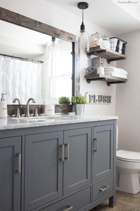 This Industrial Farmhouse Bathroom is the perfect blend of styles and creates such a cozy atmosphere! Industrial Farmhouse Bathroom, Makeover Kamar Mandi, Farmhouse Bathroom Remodel, Farmhouse Bathroom Decor Ideas, Gray Cabinets, Bad Inspiration, Minimalist Apartment, Modern Farmhouse Bathroom, Ideas Hogar