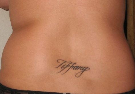 Tattoo on lower back Lower Back Name Tattoos, Back Name Tattoo, Couple Name Tattoo, Tattoo On Lower Back, Couple Name Tattoos, Tattoo Lower Back, Back Female, Couple Name, Boyfriend Names