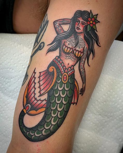 Tattooed Mermaid Tattoo | Tattoo Ideas and Inspiration Vintage Mermaid Tattoo, Traditional Mermaid, Traditional Mermaid Tattoos, Traditional Dagger Tattoo, Independent Tattoo, Mermaid Tattoo Designs, Pin Up Girl Tattoo, Traditional Tattoo Sleeve, Nautical Tattoo