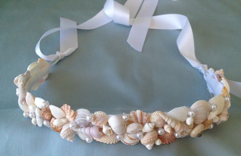 This beach wedding hair crown/tiara is a perfect addition to your destination wedding. It is made on a wire frame that is one size fits all and ties at the back with a white satin ribbon. It is completely covered in shells and little pearl beads. The inside of the crown is covered with white felt for your comfort. Such a pretty keepsake for after the wedding... Seashell Headband Diy, Diy Shell Crown, Seashell Tiara, Wedding Hair Crown, Shell Crowns, Seashell Crown, Seashell Wedding, Mermaid Crown, Hair Crown