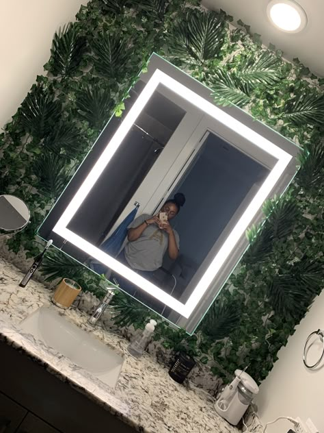 Fake Grass Bathroom Wall, Tropical Spa Bathroom Ideas, Bathroom Mirror Plant Wall, Green Bathroom Theme Ideas, Grass Wall Backdrop Bathroom, Fake Plants Bathroom Decor, Green Plant Bathroom Decor, Fake Plant Bedroom Decor, Spa Accent Wall Ideas