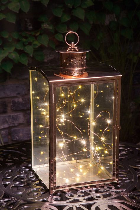 Copper Wire Lantern | Garden Solar & Battery Lighting | NOMA Garden Art Wire Lantern, Lantern Garden, Copper Wire Fairy Lights, Lantern With Fairy Lights, Modern Garden Lighting, Wire Fairy, Wire Fairy Lights, Outdoor Lantern Lighting, Outdoor Lantern