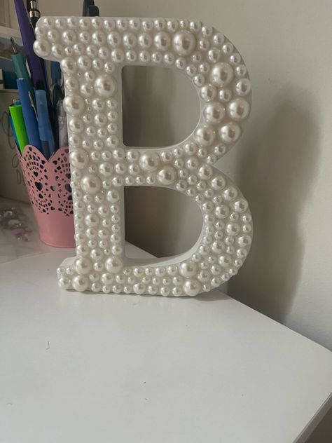 Beautiful wooden letter covered in your choice of pearls! **please note that the font is what appears in the second picture** Letter measures 7.7 x 0.75 x 8 inches Perfect bridal shower, wedding, or nursery decor! Letters Decor, Diy Initial Decor, Pearl Room Decor, Pink Diy Decor, Room Craft Ideas, Wall Crafts, Pearl Decor, Diy Bedroom Decor Ideas, Pearl Crafts