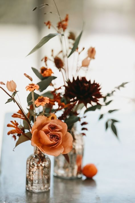 Rustic Orange Wedding Flowers, Rustic Fall Wedding Florals, Simple Autumn Centerpieces, Terracotta And Eucalyptus Wedding Flowers, Autumn Wedding Chair Decorations, Fall Flower Table Decor, Orange Fall Wedding Flowers, Rust Orange Wedding Centerpieces, Simple Terracotta Wedding Decor