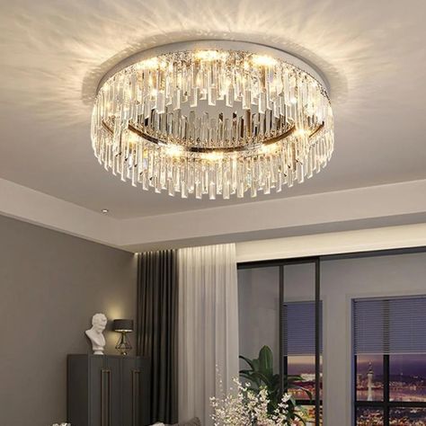 This modern ceiling lamp mainly uses stainless steel material, making it anti-rust, high-strength and durable. With beautiful crystals forming the lamp shade, it will cast a shimmering and beautiful reflection on the ceiling when on, adding elegance to your home. It is ideal for living rooms, bedrooms, dining rooms, etc. . . Find the lamp on the web: https://korewolamp.com/collections/ceiling-light/products/silver-round-crystal-ceiling-lamp . . Visit us for more： https://korewolamp.com/collec... Flush Mount Crystal Chandelier, Room Lamps Bedrooms, Stainless Steel Lamps, Classic Wall Lights, Classic Chandeliers, Modern Ceiling Lamps, Practical Lighting, Crystal Ceiling Light, Staircase Chandelier