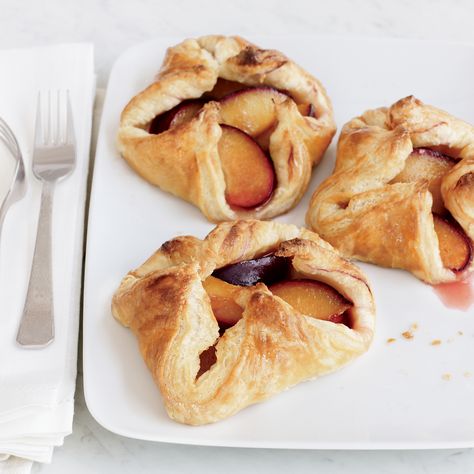 For her elegant interpretation of fruit danish, Grace Parisi tosses wedges of big purple plums with sugar and cardamom, then pinches them into neat li... Easy Puff Pastry Desserts, Plum Dessert, Fast Desserts, Plum Recipes, Puff Pastry Desserts, Easy Puff Pastry, Bake Goods, Dumplings Recipe, Dumpling Recipe