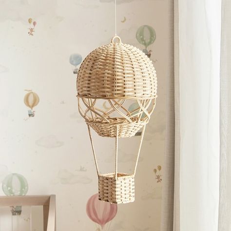 For a touch of wonder and whimsy, set their imagination aloft with our handcrafted hot-air balloon mobile. The vintage-inspired design is beautifully woven of natural rattan and comes complete with a basket for pretend passengers. DETAILS THAT MATTER Crafted from woven rattan, iron and metal. Features a nylon string for hanging. For decorative use only. KEY PRODUCT POINTS Mobiles are sold sold individually. Wipe clean. Imported. Hot Air Balloon Mobile, Wonder And Whimsy, Balloon Mobile, Hot Air Balloon Nursery, Live Oak, Woven Rattan, Free Interior Design, Vintage Inspired Design, Nursery Ideas