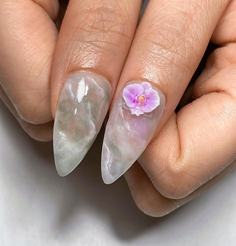 💜 Orchid Garden 🤍 Medium Stiletto Gel-X with foreign removal and complimentary hand massage for a 2.5hr session ♡ Client’s inspo request was for a muted jade theme with the addition of my orchids ☺️🌸 February spots available, please DM to book ✨ #nailinspo #naildesign #3dnailart #jadenails #snakenails #orchidnails #vancouvernails #3dnails #gelxinspo #gelxnails #trendynails #nails2inspire #pinterestnails #stilettonails Orchid Color Nails, Aesthetics Nails, Tropical Nail Art, Orchid Nails, Medium Stiletto, Jade Nails, Tropical Nails, Orchid Garden, Orchid Color