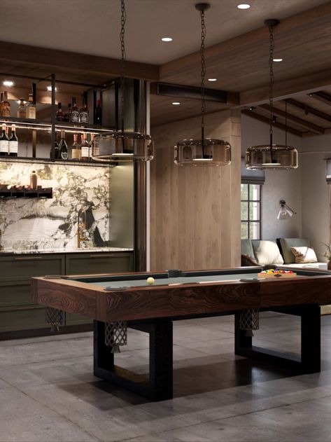 A special place is designated for the billiards room. It’s a separate space that can be divided into several zones for different leisure scenarios. The billiards table takes center stage. A wine fridge, mini kitchen for cocktail preparation, and custom bar counter create a space for heartfelt conversations over drinks. The gaming machine contrasts with the classic billiards table but speaks to the owners’ sense of humor. Bar Rec Room Ideas, Pool Table Room With Bar, Luxury Games Room, Modern Games Room, Pool Table Restoration Diy, Homemade Pool Table, Pool Table Bar Room Ideas, Home Pool Table Room, Moody Game Room Ideas