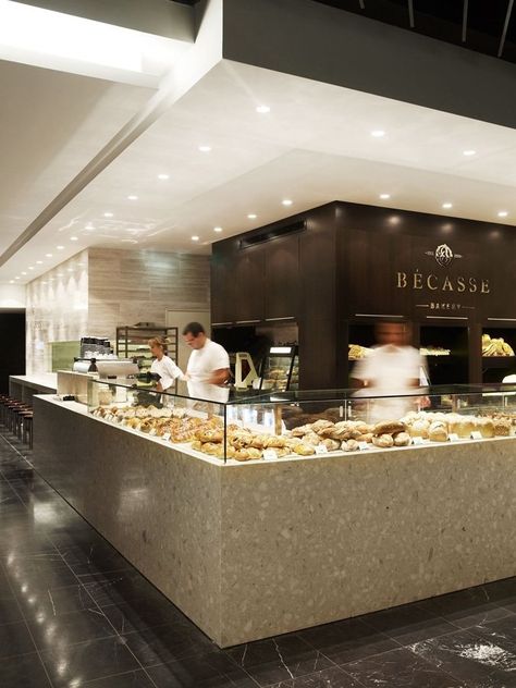 The design of a boutique bakery in a Sydney shopping mall reflects the luxury of the pastries which it sells. With just 100-sq-m to work with, the priority for designer Mark McConnell was naturally the kitchen space. Equipped with two ovens, proofer, pastry benches, mixers and a cooling room, the kitchen can be seen from the storefront and mall hall. ‘The retail display was to be very simple to allow a broad layout of the various pastries and breads the French bakers were preparing in the bac... Arabian Restaurant, Food Court Design, Bakery Shop Design, Bakery Interior, Bakery Design Interior, Bakery Decor, Cafe Bistro, Bakery Design, Coffee Shop Design