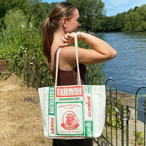 The perfect holiday tote bag, made from upcycled rice sacks. Extremely lightweight, waterproof and durable, they are great for the beach, with rope handles and a zipped inner pocket for valuables. Handmade by women in rural areas of Sri Lanka, they are sustainable, practical, colourful and fun! #handmadeinsrilanka #totebag #beachbag #festivalbag #upcycledbags #ricesack #ricesackbag #recycledricesack Holiday Tote Bag, Sack Bag, Festival Bag, East Asian, Rope Handles, Beach Bag, Sri Lanka, The Beach, Rice