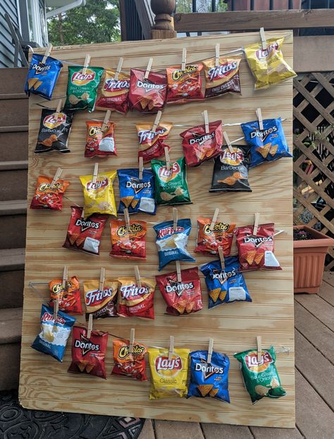 Thought this would be a better way to have our guests "shop" for their favorite chips at our birthday bbq. Chip Bar Party, Chip Party Display, First Birthday Snack Table, Chip Wall, Chips For Party Display, How To Display Chips At A Party, Chips Display For Party, Potato Chip Display For Party, Chip Holder For Party