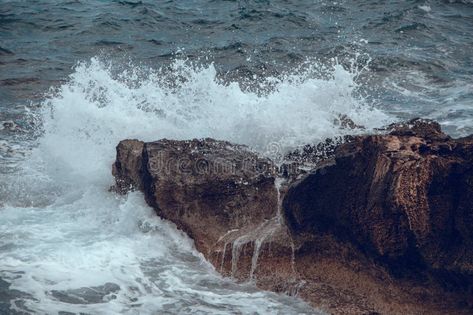 Water splashes. Waves in the sea hit the rocks on the shore royalty free stock photo Natural Wallpaper, About Water, Free Stock Photos, The Rock, Rocky, The Sea, Royalty Free Stock Photos, Royalty Free, Royalty