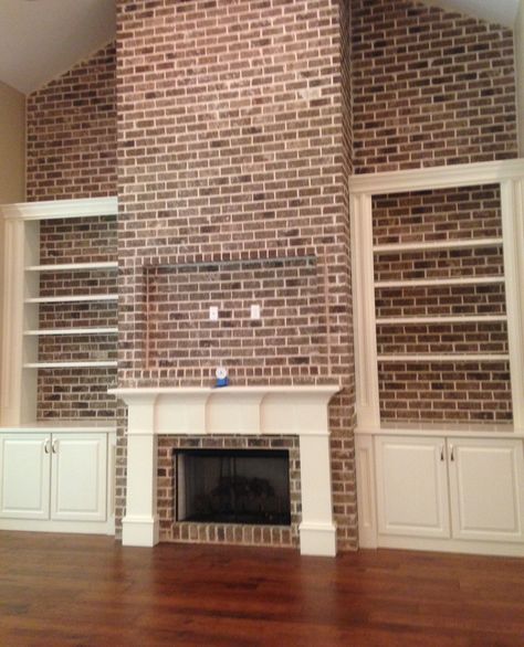 Brick Wall Built Ins, Brick Wall Bookshelves, Brick Wall With Floating Shelves, Brick Wall With Shelves, Brick Fireplace With Shelves On Side, Full Brick Wall Fireplace, Brick Wall With Fireplace, Shelves On Brick Wall, Brick Fireplace With Built Ins