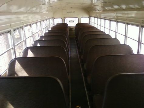 (This link will be useful, too) Keep two seats in the front on the wall with no door, except make them face each other, re-upholster them to match the rustic style, and put a simple wood table in between that matches the planned kitchen counter-tops. Converted Bus, Bus Interior, Bus Living, School Bus Conversion, Bus House, Folding Seat, Magic School Bus, Bus Conversion, Design Innovation