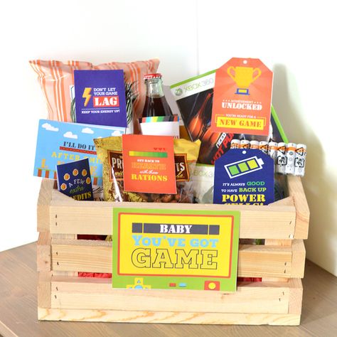 Give the perfect gamer gift - a basket filled with everything from energizing snacks to practical video game necessities. Coffee Lover Gifts Basket, Baskets Christmas, Movie Night Gift Basket, Christmas Gift Baskets Diy, Gift Baskets For Him, Baskets For Men, Gift Baskets For Men, Themed Gift Baskets, Diy Gift Baskets