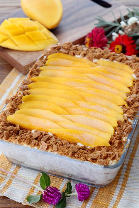 Mango Graham Float or Mango Royale is a favorite Filipino 'icebox cake'  that is a big hit during the holiday seasons or any other special occasion. It is so easy and yummy to make and only needs 4 ingredients too! It is  | www.foxyfolksy.com #dessert #sweets #cakerecipe #easy #mangorecipe #mangofloat #mangograham Mango Float Recipe Filipino Desserts, Mango Royale, Mango Float Recipe, Mango Graham Float, Mango Graham Cake, Graham Recipe, Fruits Benefits, Graham Dessert, Mango Graham