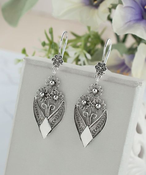 Spring has sprung on your earlobes! 🌸 Unveil your inner blossom with our artisan-crafted 925 Sterling Silver Bunch of Flower Design Dangle Earrings, where filigree art meets floral fantasy. Every petal tells a story of skilled craftsmanship and elegance. Ready to pick your flowers? Click the link for a bloom that never fades 💐✨ 👉 Explore the romance of silver florals here: https://nuel.ink/3XAMaB #SilverElegance #FloralJewelry #ArtisanCrafted #SpringStyle #UniqueEarrings #MustHave #JewelryL... Filigrana Jewelry, Sterling Silver Flower Earrings, Character Clothing, Gemstone Drop Earrings, Silver Flower Earrings, Filigree Jewelry, Stylish Earrings, Vintage Style Earrings, Filigree Earrings