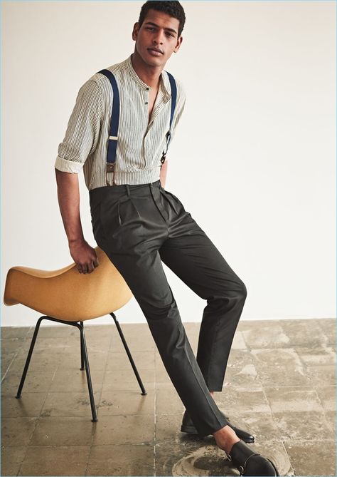 Making a case for suspenders, Tidiou M'Baye wears Mango Man adjustable elastic braces $49.99. He also sports a Mango Man striped grandad collar shirt $49.99, pleated trousers $59.99, and leather monk strap shoes $119.99. Suspenders Outfit Men, Suspenders Men Fashion, Suspenders Casual, Suspenders Fashion, Suspenders Outfit, Grandad Collar Shirt, Charcoal Dress, Mens Fashion Dressy, Suspenders Men