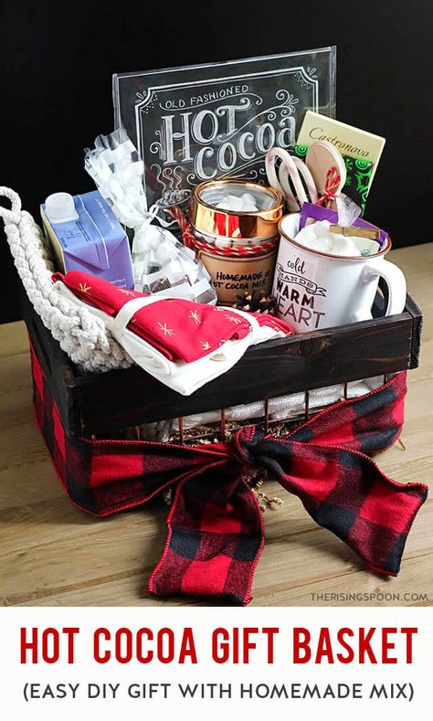 Learn how to put together a cozy & festive DIY hot cocoa gift basket in minutes with a homemade hot cocoa mix (easy recipe included), marshmallows, bar chocolate, and a few other fun and unique goodies (like hot chocolate bombs). This makes a simple, yet thoughtful gift for all ages (kids included) & any occasion, especially Christmas. Keep reading for lots of inspiration & ideas! Hot Chocolate Bucket Gift, Hot Cocoa Bar Gift Ideas, Hot Cocoa Gift Baskets, Hot Coco Basket Gift Ideas, Adult Hot Chocolate Gift, Hot Chocolate Bar Gift Basket, Hot Chocolate Gift Basket Ideas, Hot Cocoa Gift Basket Ideas, Hot Cocoa Basket