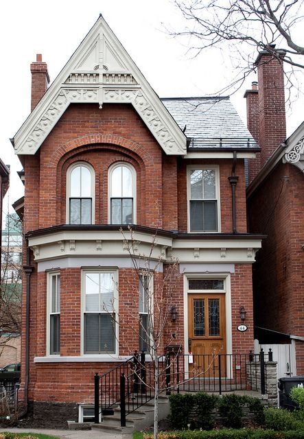 This bay and gable Victorian house is located at 24 Hazelton Avenue in the neighborhood of Yorkville, Toronto. Yorkville Toronto, Toronto Houses, Victorian Style Homes, Victorian Architecture, Victorian House, Sims House, The Neighborhood, Brick House, Pretty House