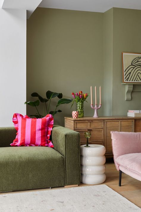 Sage Green Room Accents, Green Accent Colors Living Room, Different Shades Of Green Living Room, Green Sofa Mid Century Living Room, Colourful Neutral Living Room, Oliver Bonas Living Room, Wall Colors For Green Couch, Green Sofa Pink Rug, Green English Living Room