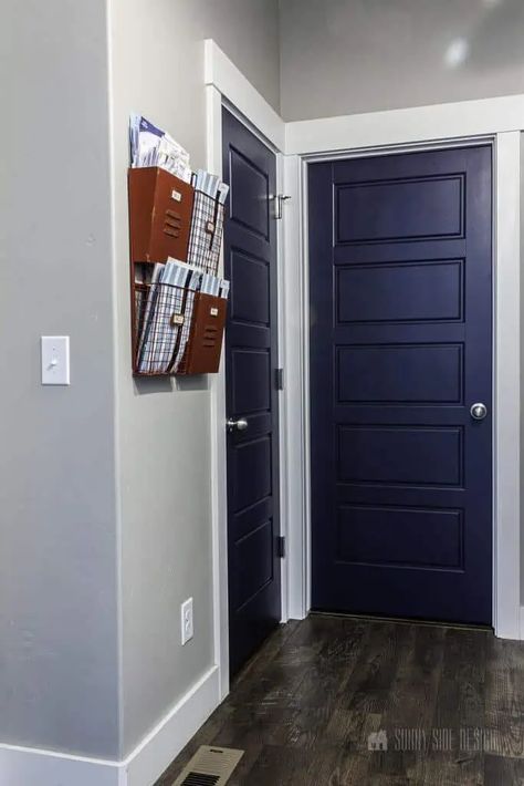 If you don't want to go with dark gray or black for your door color, you could try something with slightly more color - like navy blue! Navy Interior Doors, Paint Interior Doors, Interior Doors Black, Painting Interior Doors, Blue Painted Door, Painting Interior Doors Black, Blue Interior Doors, Wagner Paint Sprayer, Painting A Room