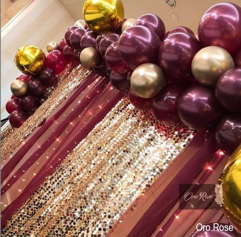 Ooze glimmer and shimmer all around your party space with a gleaming backdrop. Arrange burgundy chiffon and gold big Payette sequin curtains on a backdrop stand. Bedeck the backdrop with gold, rose gold and burgundy colored balloons for a spectacular appeal. Also, suspend fairy string lights from the backdrop to impart a magical glow to the ambiance. Burgundy Backdrop, Rose Gold And Burgundy, Event Decor Ideas, Sequin Curtains, Party Decorations Table, Decorations Table, Fairy String Lights, Backdrop Decorations, Backdrop Stand