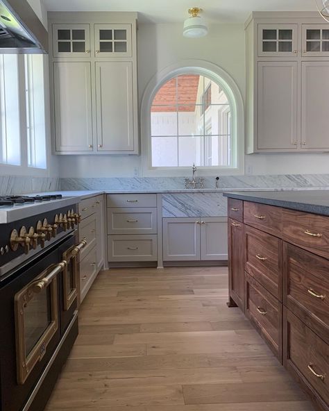 Whitney Williams on Instagram: “There are so many pretty finishes in this kitchen. The arched window, the marble sink, the black walnut island and the beautiful range!…” Cabinets Over Kitchen Sink Window, Arched Window Over Kitchen Sink, Arch Window Kitchen, Arch Kitchen Window, Arched Kitchen Window, Black Walnut Island, Window Over Kitchen Sink, Over Kitchen Sink, Walnut Island