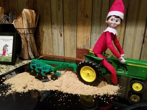 Elf on the Shelf does some farming! Farming Elf On The Shelf, Western Elf On The Shelf Ideas, Elf On The Shelf Tractor, Elf On The Shelf Tractor Ideas, Farm Elf On The Shelf Ideas, Cowboy Elf On The Shelf Ideas, Elf On The Shelf Horse Ideas, Elf On The Shelf Farm Ideas, Country Elf On The Shelf Ideas