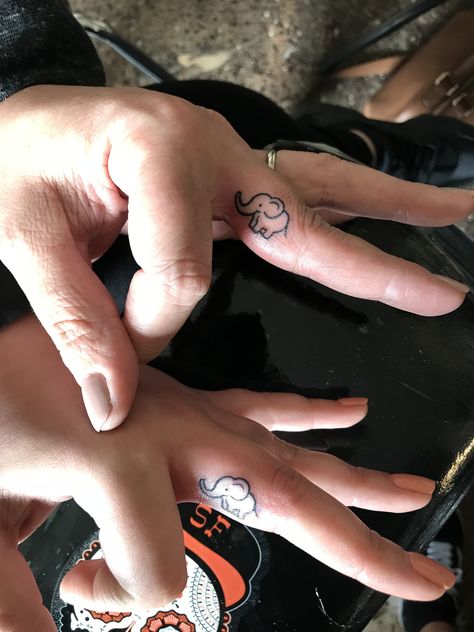 Mother daughter matching tattoos Small elephant tattoo Finger tattoo Elephant Finger Tattoo, Mother Daughter Matching Tattoos, Little Elephant Tattoos, Small Elephant Tattoo, Mom Daughter Tattoos, Tattoo Finger, Elephant Tattoo Design, Daughter Tattoo, Stylish Tattoo