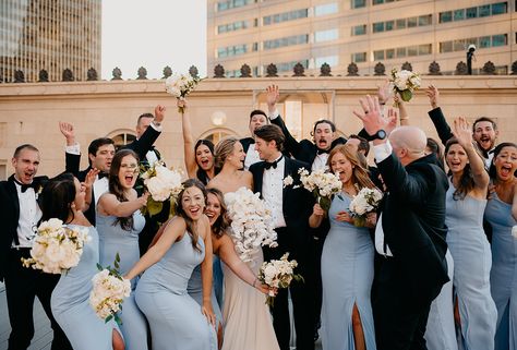 Jackie + Bryce | Downtown Rooftop - Camera Shi Photography Black Suit Blue Dress Wedding, Dusty Blue Wedding With Black Suits, Blue Bridesmaids Dresses With Groomsmen, Black Tux Bridal Party, Wedding Party Black Suits, Blue Bridesmaid And Groomsmen, Blue Black And Cream Wedding, Black Tux With Blue Tie, Groomsmen Bridesmaids